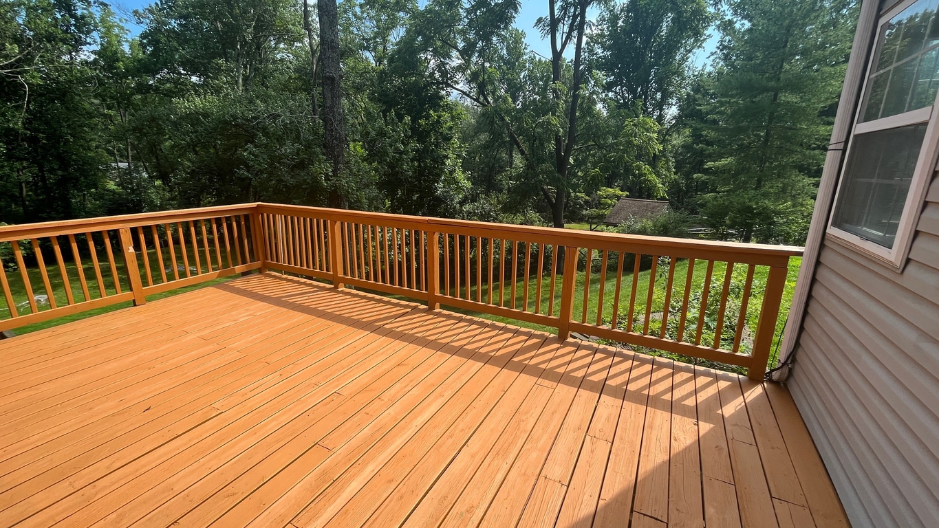 Custom-built wood deck with railing in Maryland Heights, Missouri