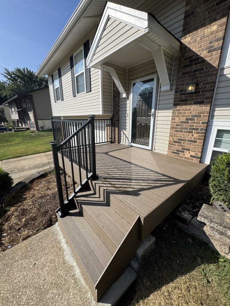 Composite deck with black aluminum railing and stair rail on a St. Louis home