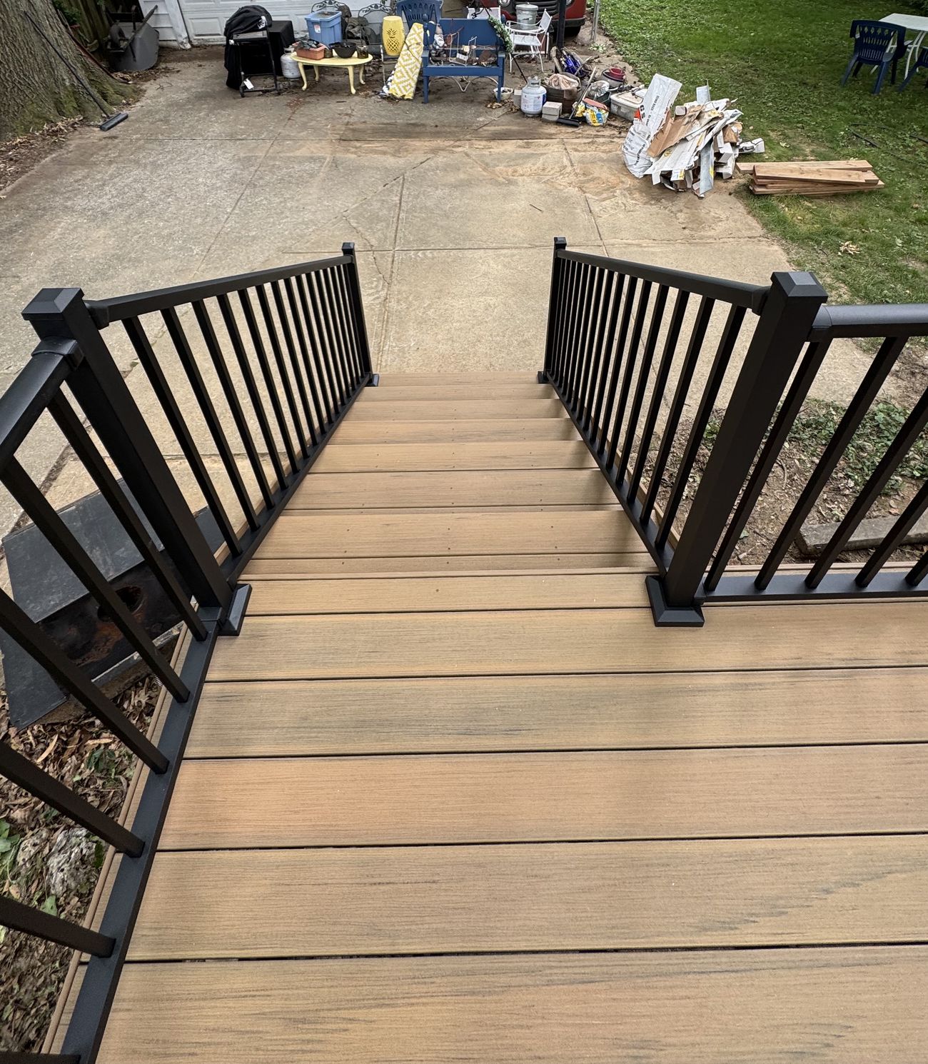 Black Westbury aluminum stair rail on composite deck steps in St. Louis
