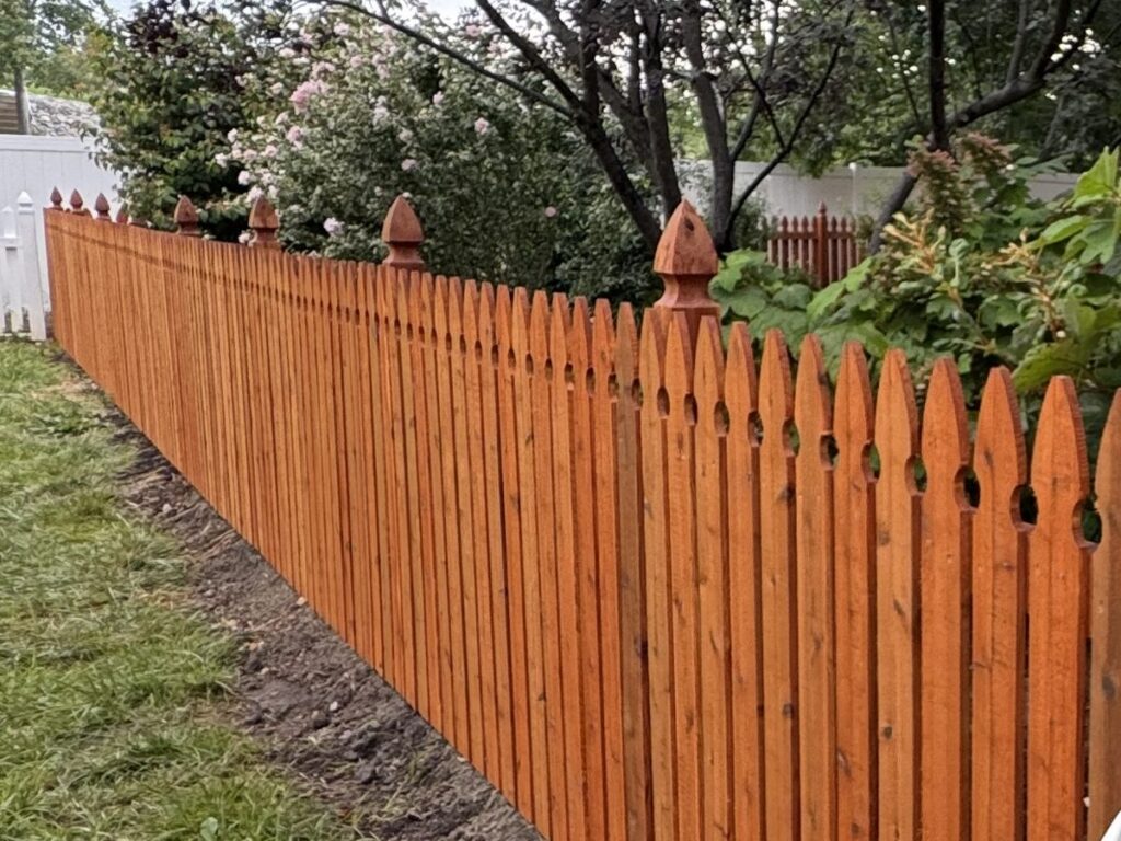 Stained cedar picket fence with French gothic posts, St. Louis MO