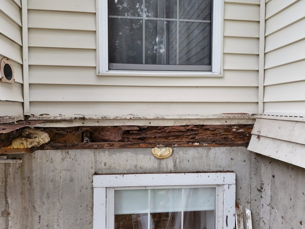 Rotted ledger board and rim joist found during a St. Louis deck repair