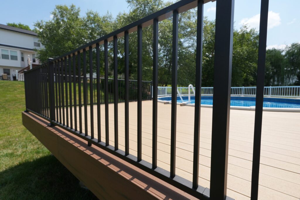 Westbury Tuscany black aluminum railing on a composite pool deck