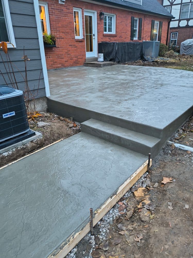 Stamped and stained concrete patio with steps
