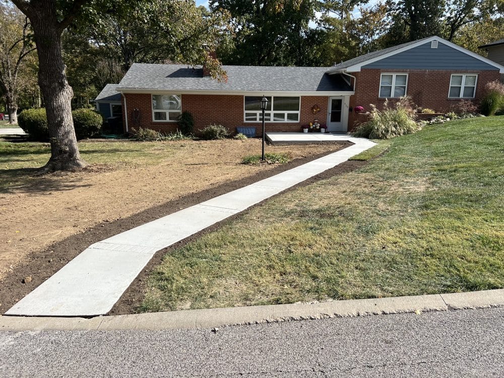 New concrete front walkway and stoop with borders graded for sod