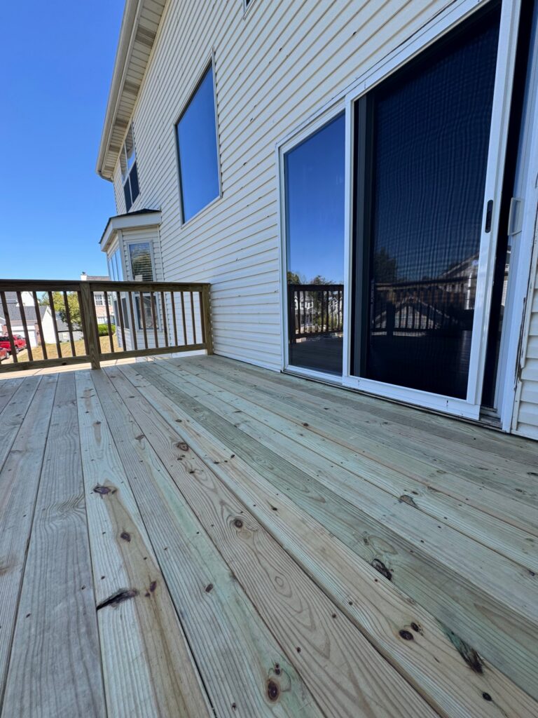 Underside of a revamped deck showing joists and ledger