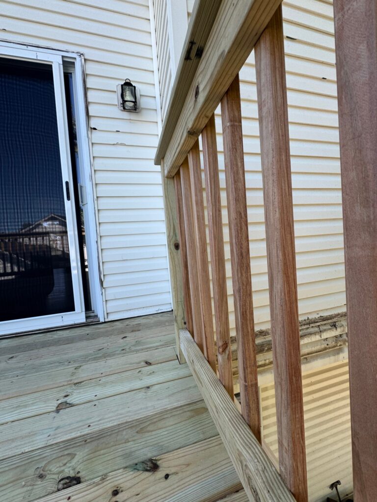 New deck boards and railing on a revamped elevated deck
