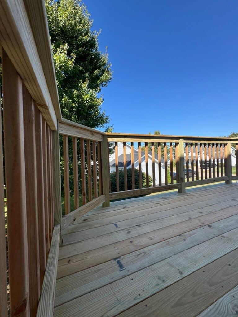 After: new balusters and railing on a revamped deck