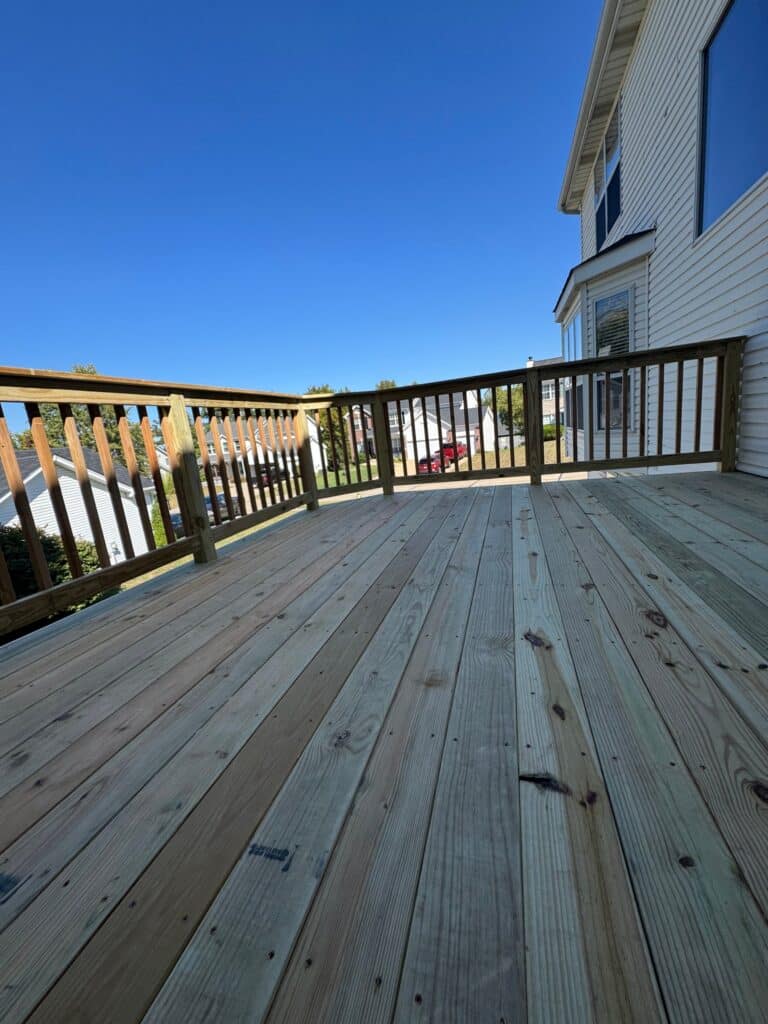 Side view of a revamped elevated deck over a patio
